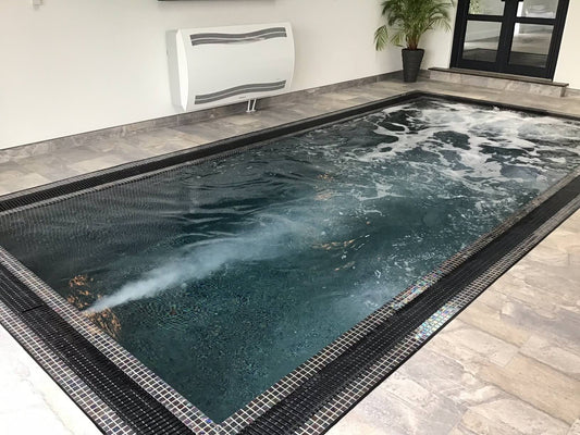 Mosaic Infinity Swim Spa by Spa Living with six seats, showcasing the spacious interior and modern design of the swim spa.