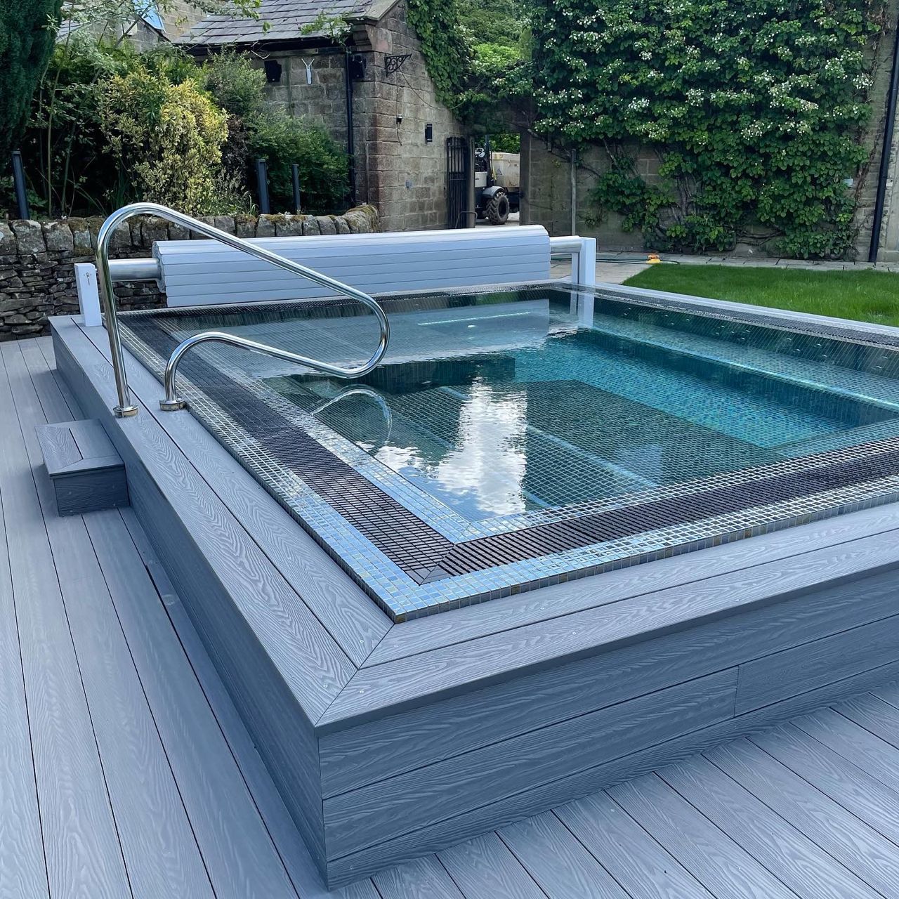 Spa Living Mosaic Square Vitality Spa Pool with cover, designed for five people, featuring vibrant mosaic tiles and durable spa equipment.