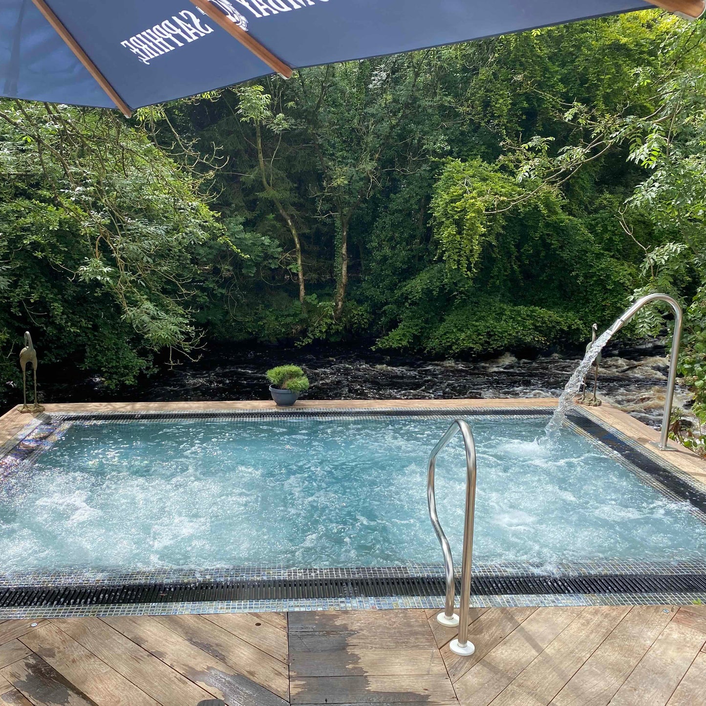 Galgorm Spa with Mosaic Square Vitality Spa Pool for 5 people, showcasing luxurious spa equipment from Spa Living.
