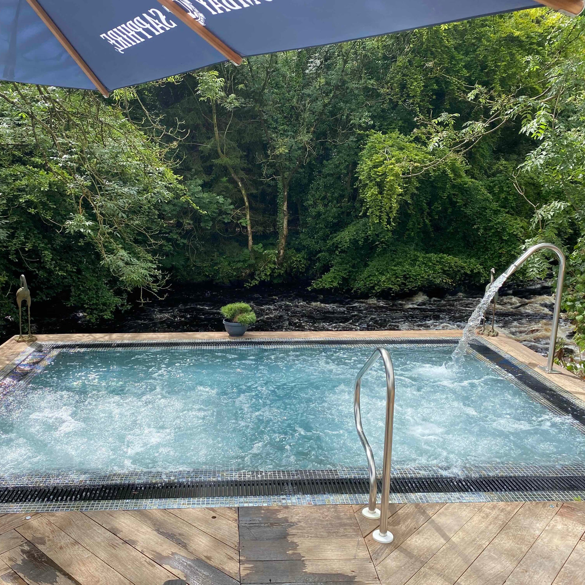 Galgorm Spa with Mosaic Square Vitality Spa Pool for 5 people, showcasing luxurious spa equipment from Spa Living.